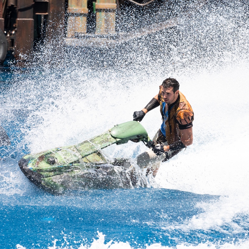 Man escaping from his enemies on a jet-ski